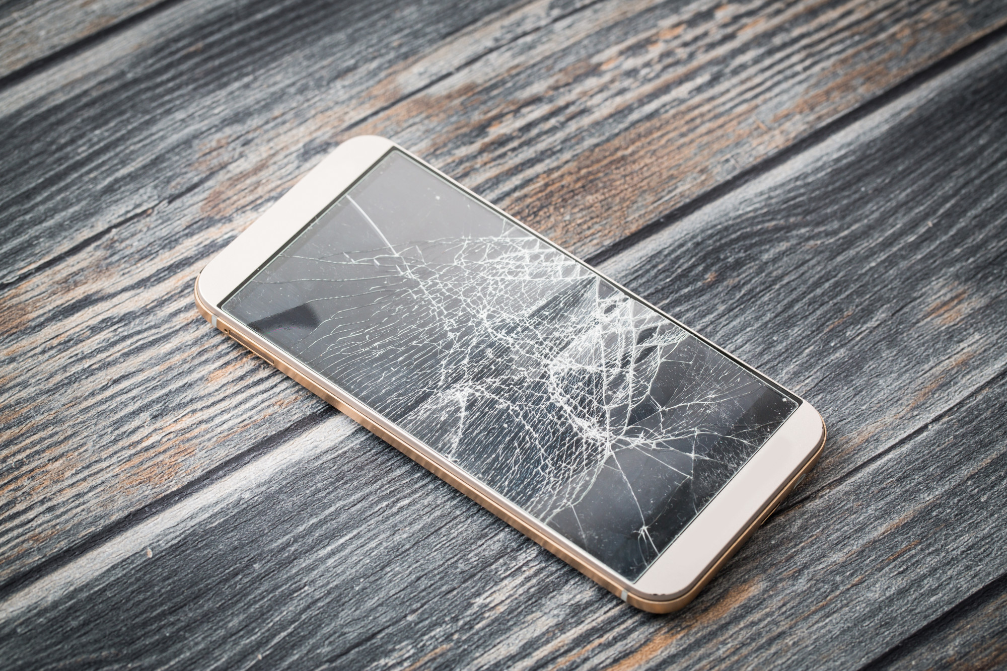 A cracked phone screen showing visible damage, symbolising the impact of screen damage on resale value.